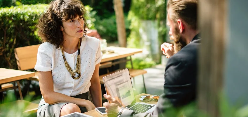 Professional business consulting team discussing strategy and working together in a modern office