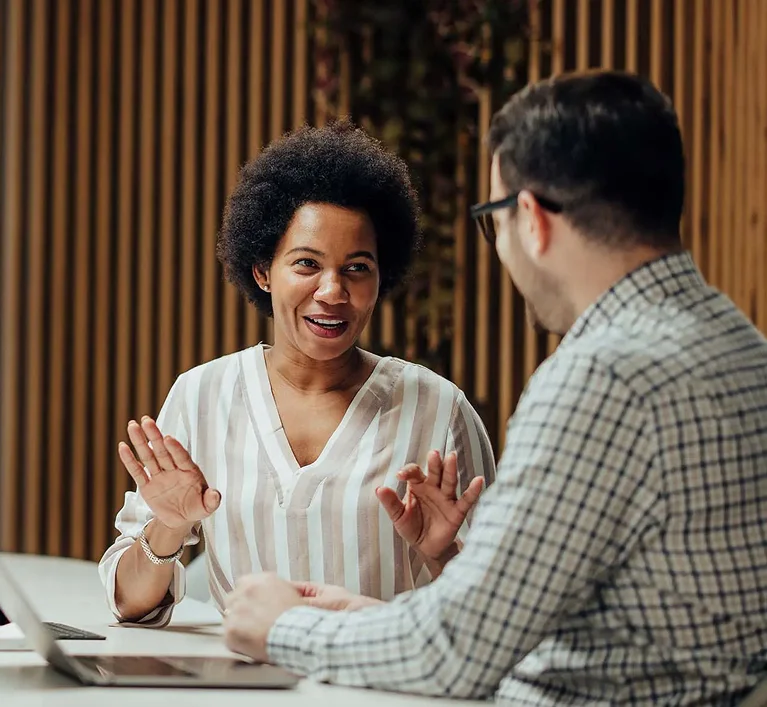 Professional business consulting team discussing strategy and working together in a modern office